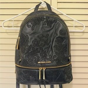 Michael Kors black embossed backpack purse